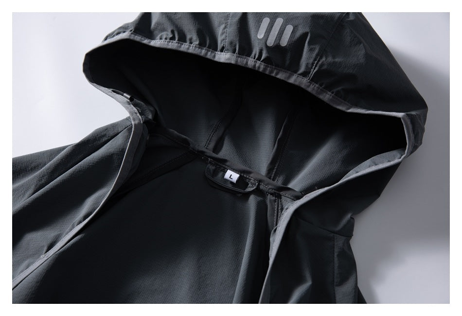 Close-up of a dark gray jacket hood lining, showing a size L label and three-bar mark.