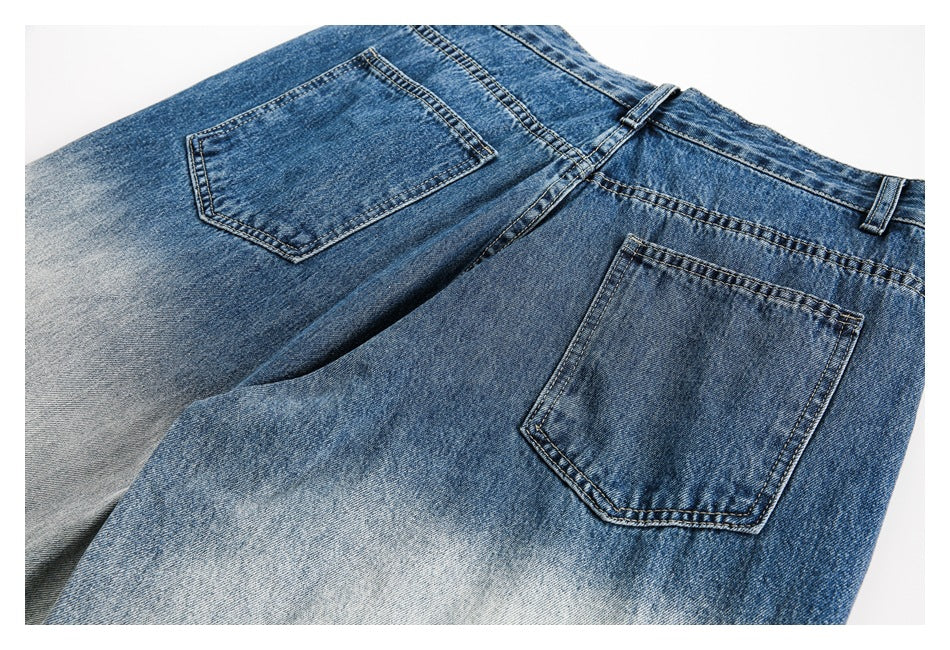 Two blue jeans colorways shown from the back, with rear pockets and contrasting faded washes.