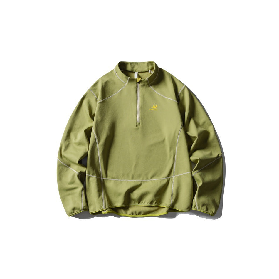 Green half-zip pullover flat lay with light contrast stitching and yellow chest logo