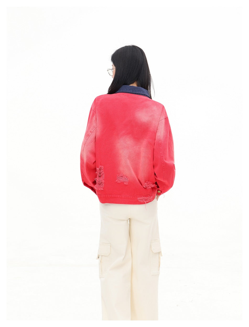 Back view of a model wearing a faded red jacket with a dark blue collar and distressed details near the hem.