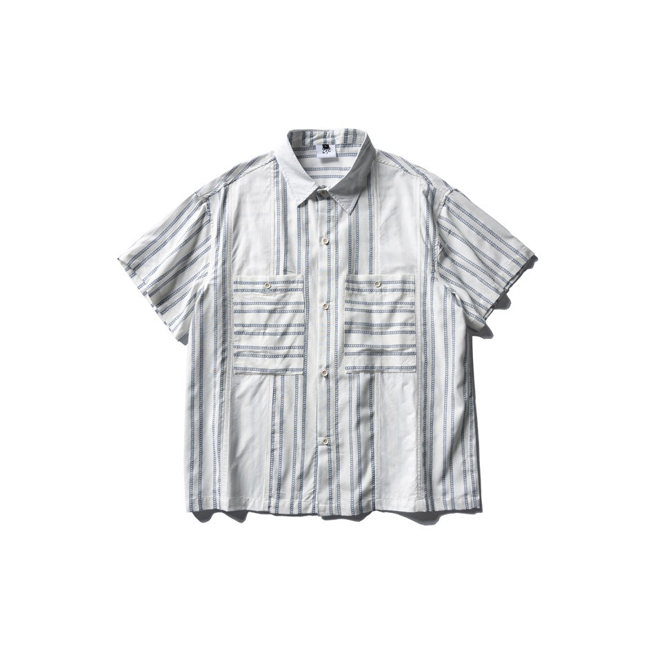 White short-sleeve shirt with blue chain-pattern stripes, collar, button front and two chest pockets, flat lay