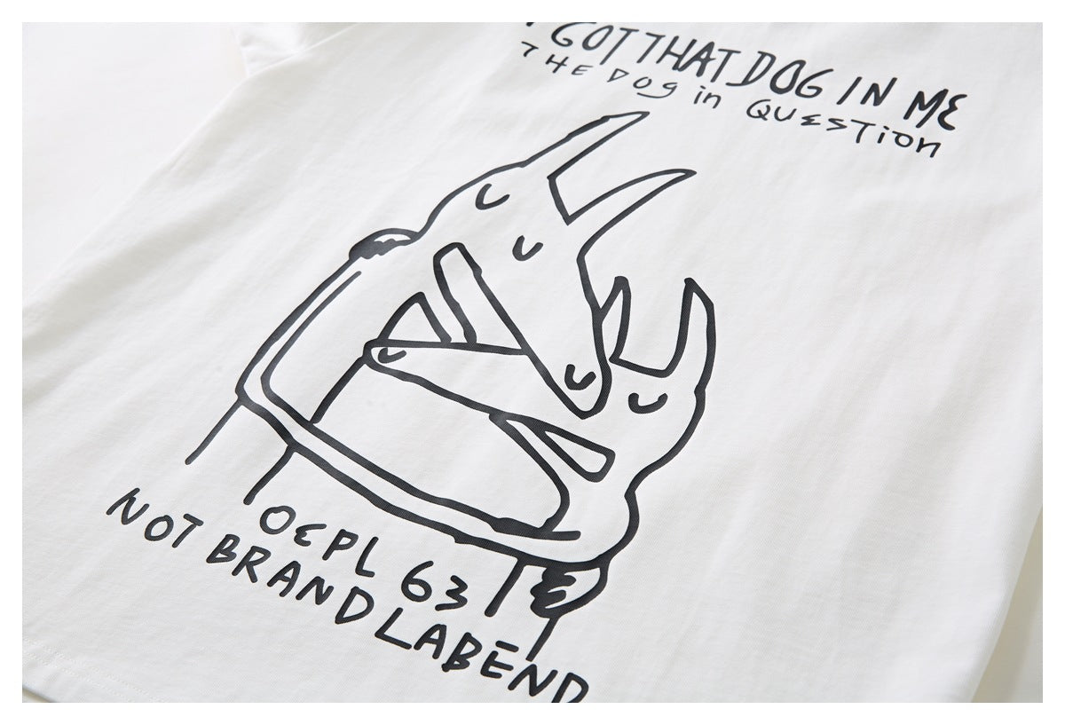 Close-up of a white T-shirt graphic showing a black line-art illustration and handwritten lettering.