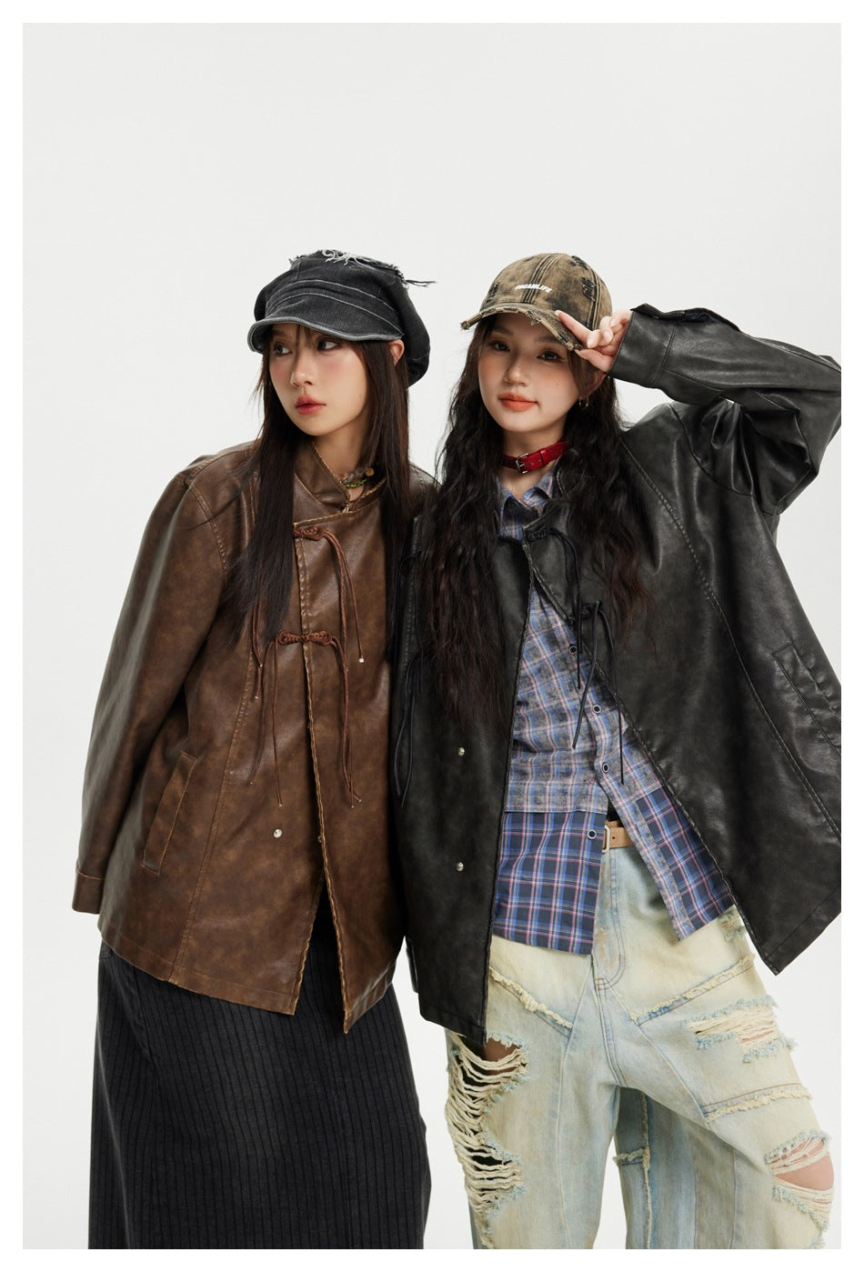 Two models pose in brown and black mottled jackets with stand collars and decorative tie closures.