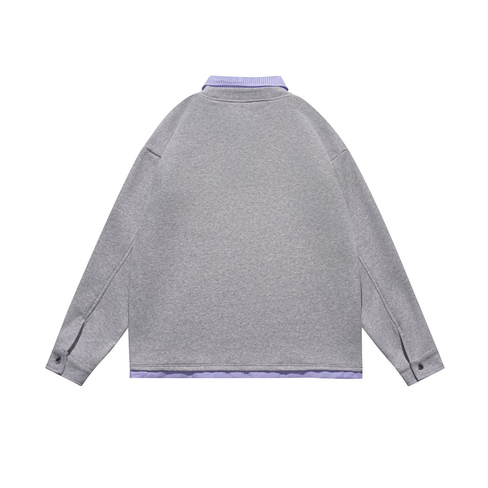 Back view of a gray long-sleeve top with a lavender striped collar and matching striped hem trim.