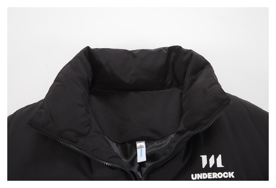 Close-up of a black puffer jacket's padded high collar, front zipper, neck label, and white chest logo.