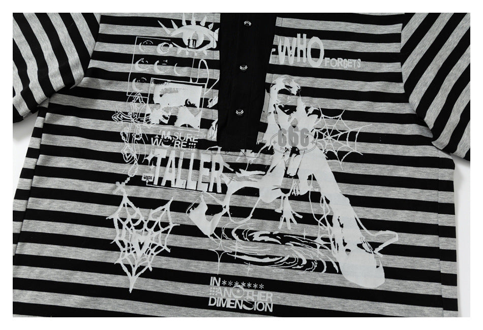 Front view of a black-and-gray striped shirt with a black button placket and large white graphic print.