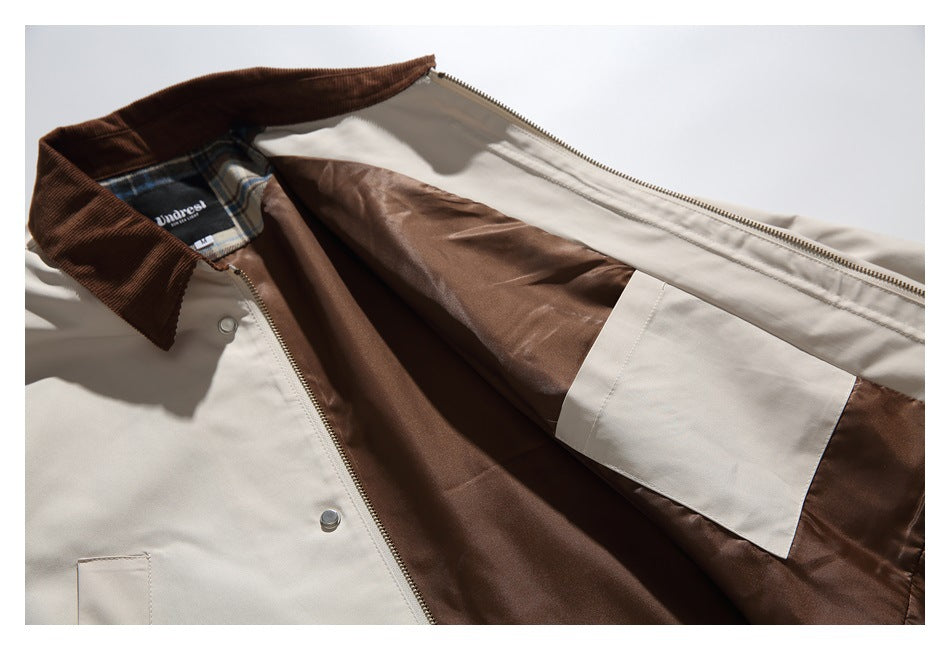 Beige jacket opened to show brown lining, an inner pocket, a brown corduroy collar, and a small neck label.
