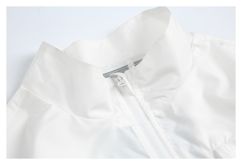 Close-up of a white jacket's raised collar and front zipper.