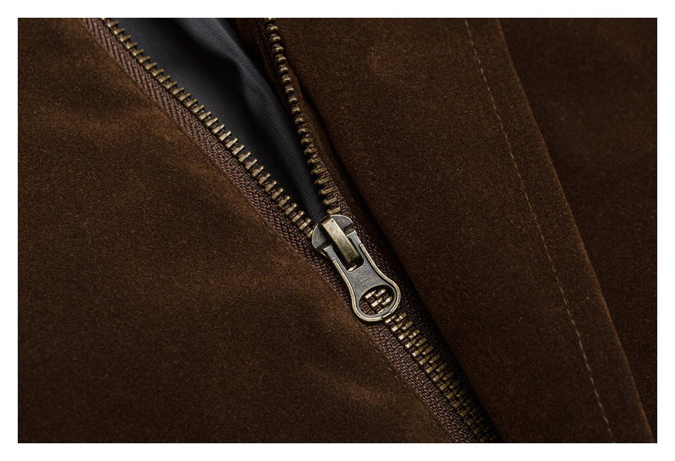 Close-up of a metal zipper set into dark brown fabric.