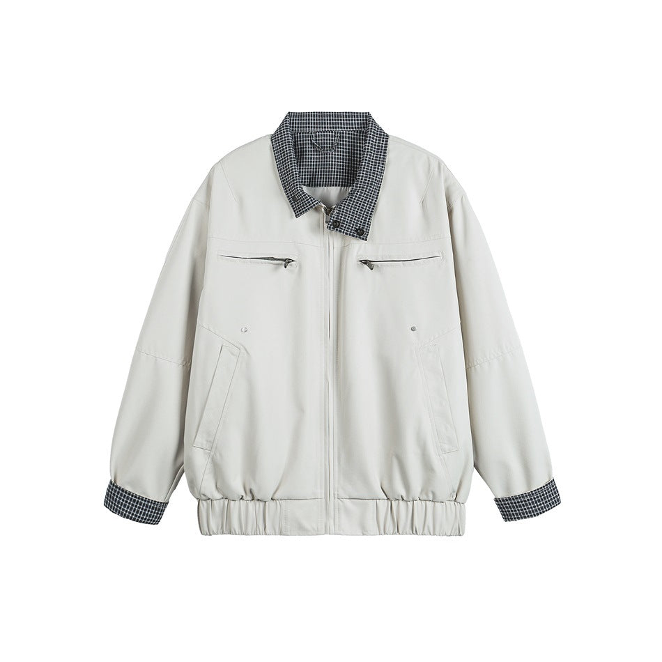Front view of an off-white jacket with checked collar and cuffs, a center zipper, and four pockets.