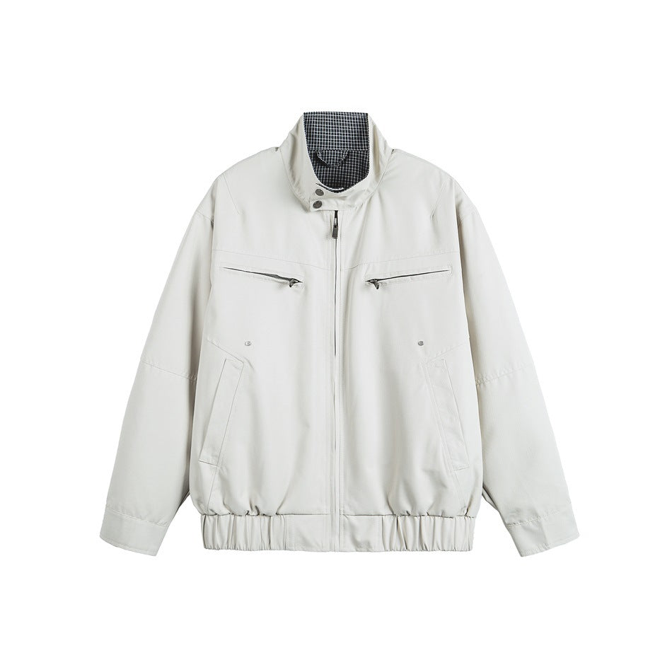 Light beige-gray stand-collar zip jacket with chest zip pockets and elastic hem, front flat view