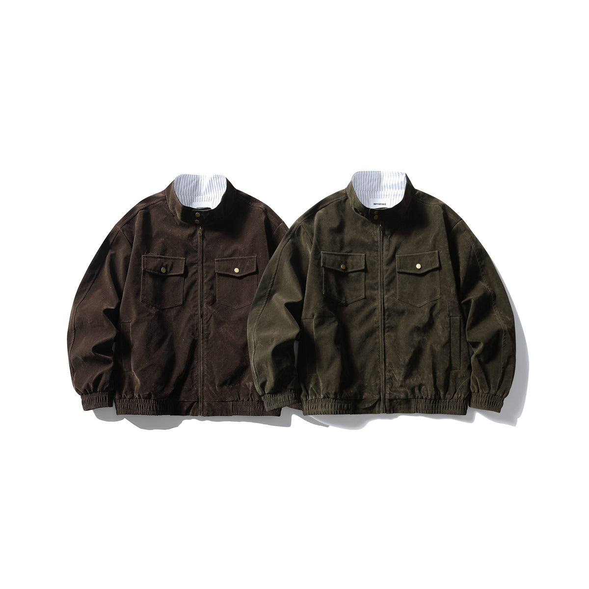 Two jackets shown from the front: one dark brown and one dark olive, each with a stand collar, zip front and snap-flap