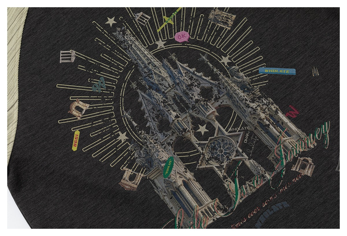 Close-up of the top's illustrated architectural graphic with stars and decorative lettering on charcoal fabric.