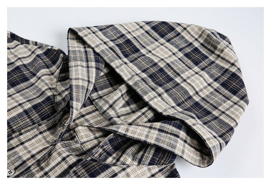 Close-up of the jacket's plaid hood and neckline.
