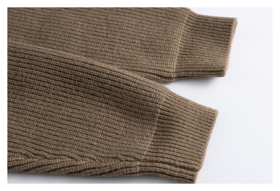 Close-up of the brown cardigan's two long rib-knit sleeves and cuffs.