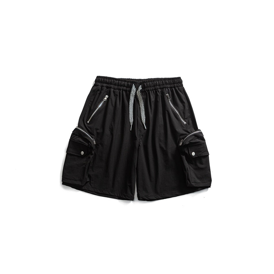 Black cargo shorts flat lay with drawstring waist, zippered front pockets and snap-flap side cargo pockets