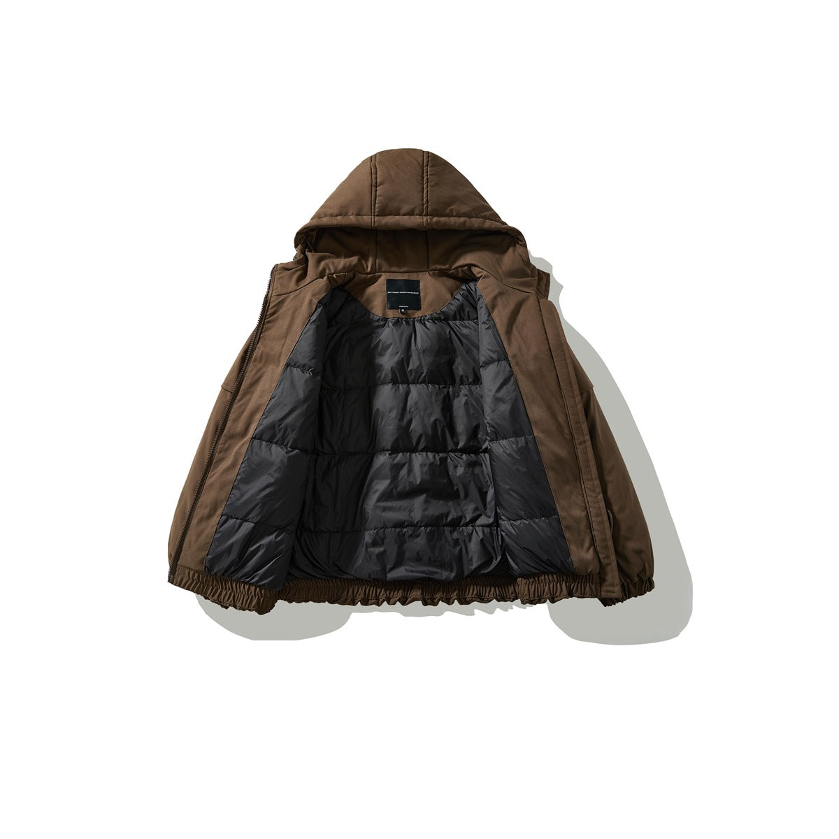 Brown hooded jacket opened to show its black quilted lining and inner neck label.