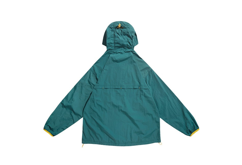 Back view of a teal hooded jacket laid flat on white, with a small emblem on the hood and yellow sleeve accents.