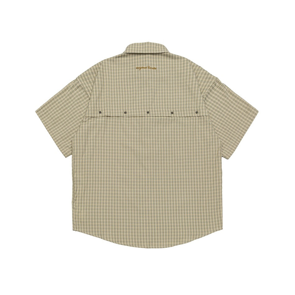 Back view of beige-yellow plaid short-sleeve shirt with brown embroidery at the collar and a row of studs across the yoke
