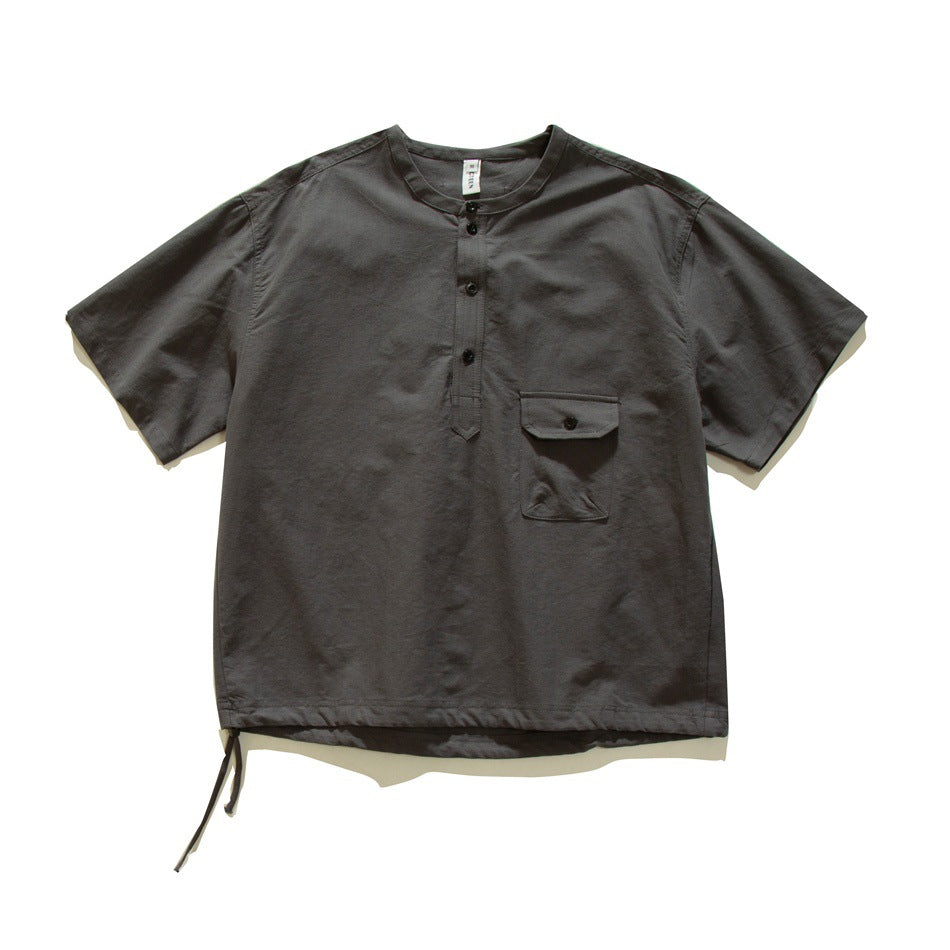 Dark gray short-sleeve pullover shirt with button placket, flap chest pocket and drawstring hem, flat lay front