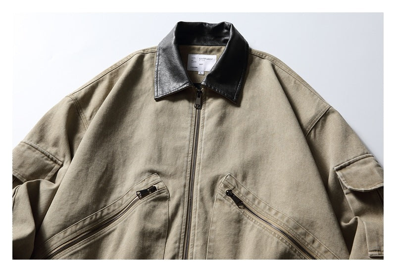 Cropped front view of a taupe jacket with a black collar, center zipper, angled zip pockets, and flap sleeve pockets.