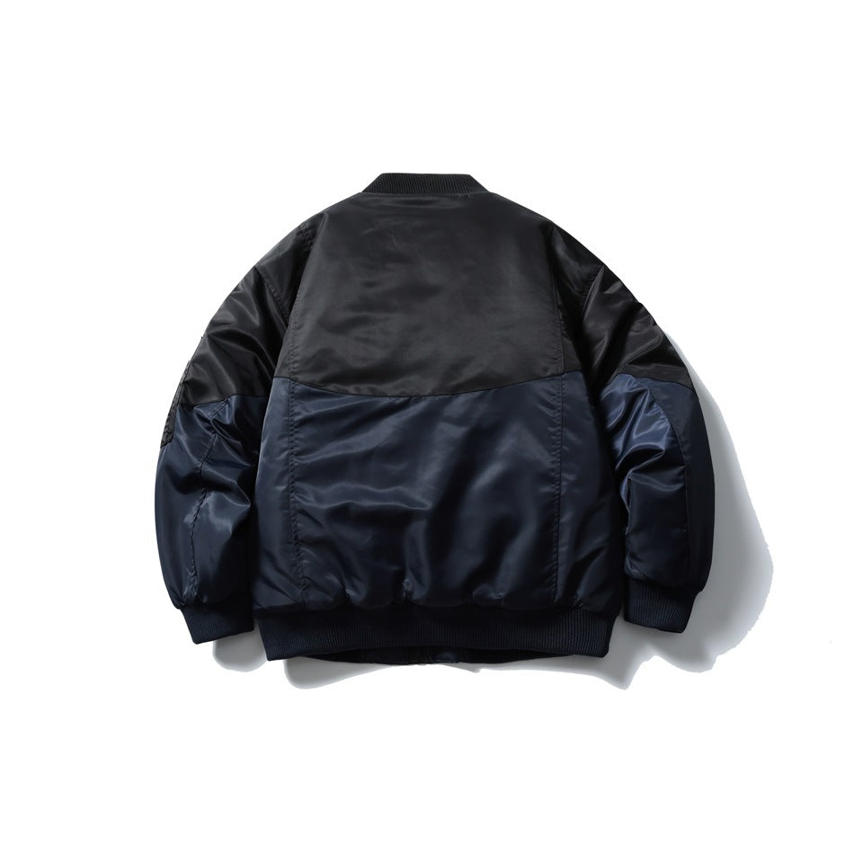 Back view of navy and black color-block bomber jacket with ribbed collar, cuffs and hem