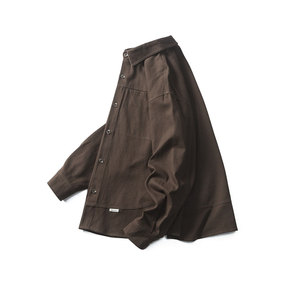 Angled front view of a dark brown button-up shirt with a pointed collar, chest pocket, and long sleeves.