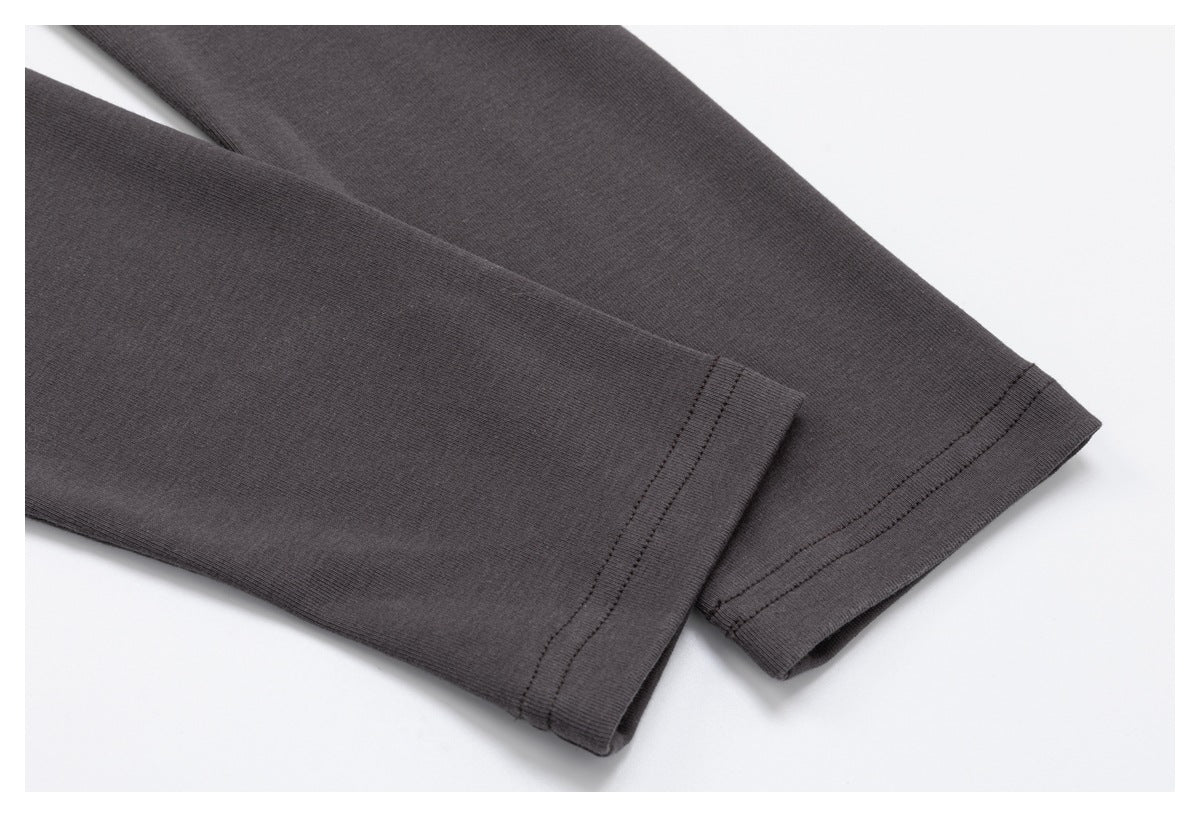Close-up of two charcoal sleeves with stitched cuffs.