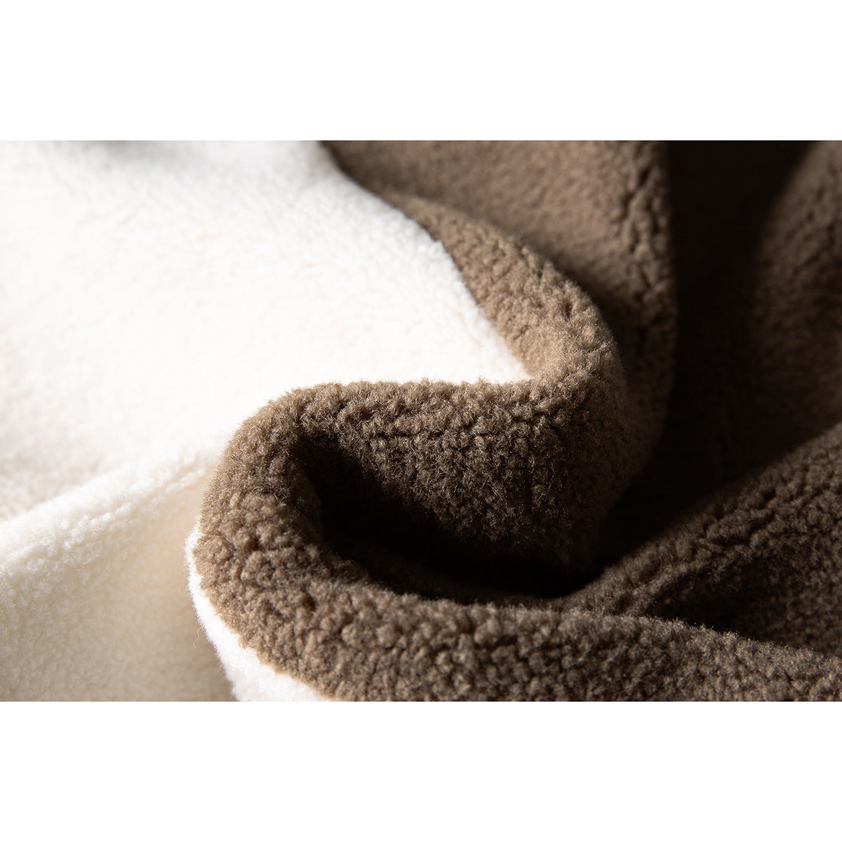 Extreme close-up of the brown and cream looped fleece fabric on a jacket.