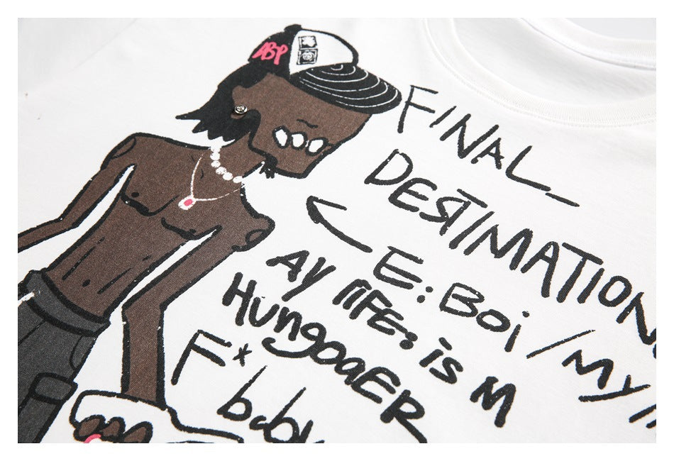 Close-up of the white T-shirt print showing a cartoon figure wearing a cap beside handwritten-style black text.