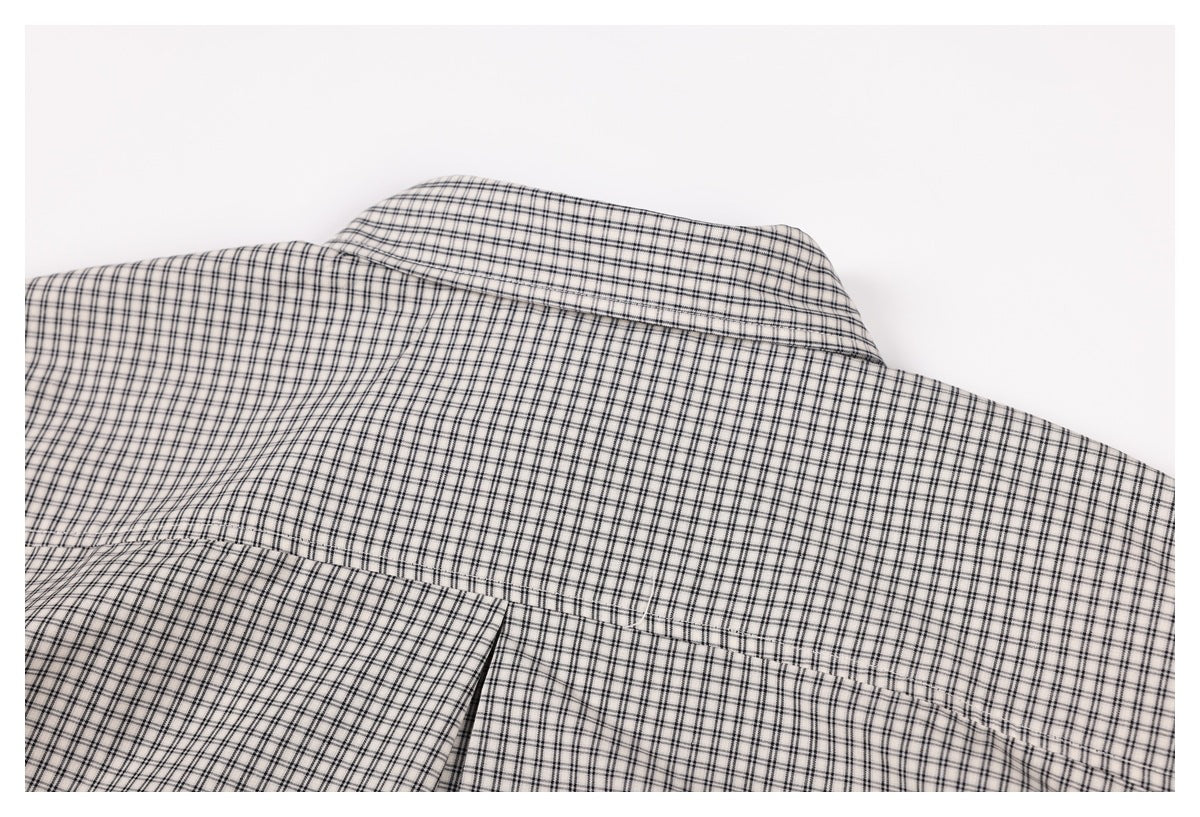 Close-up of the checked shirt's back collar and shoulder yoke.