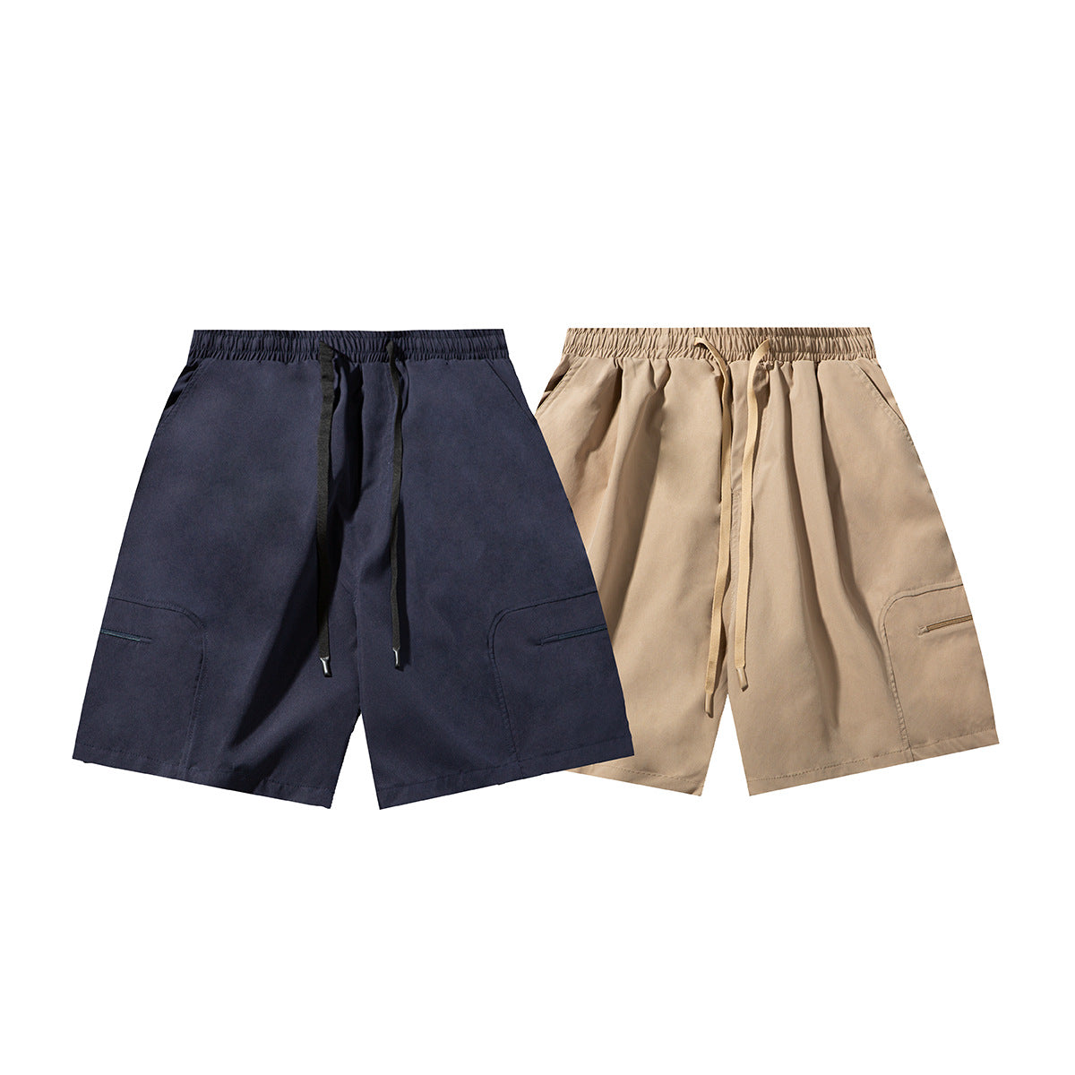Navy and beige drawstring shorts shown side by side from the front, each with zippered leg pockets.