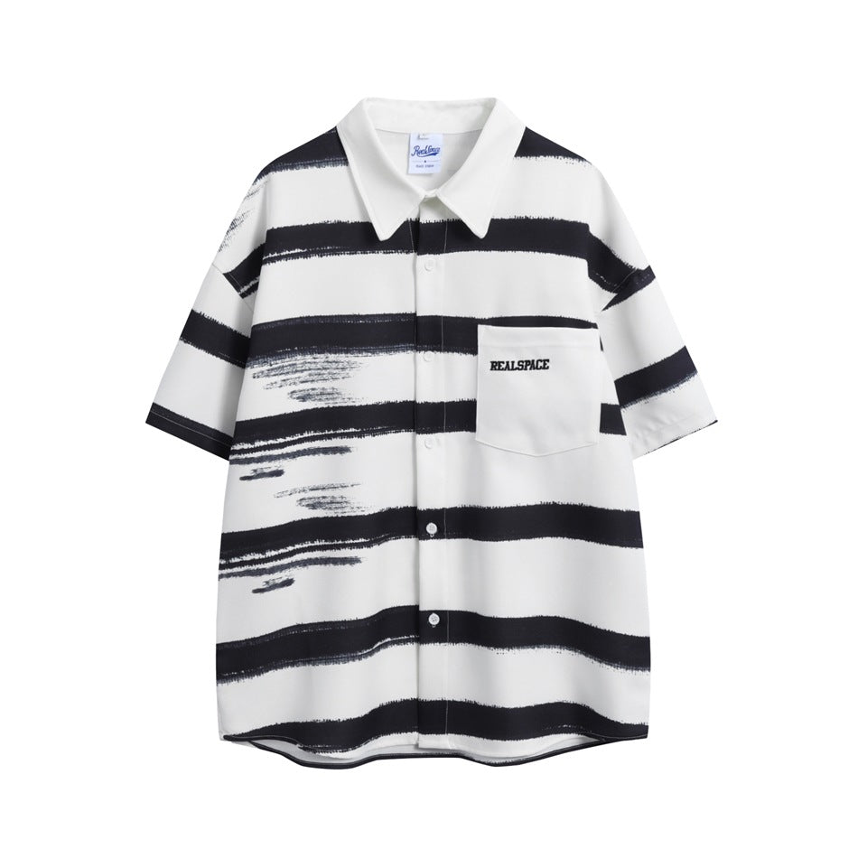 White short-sleeve button-up shirt with black brush-stroke horizontal stripes and a chest pocket with embroidered lettering