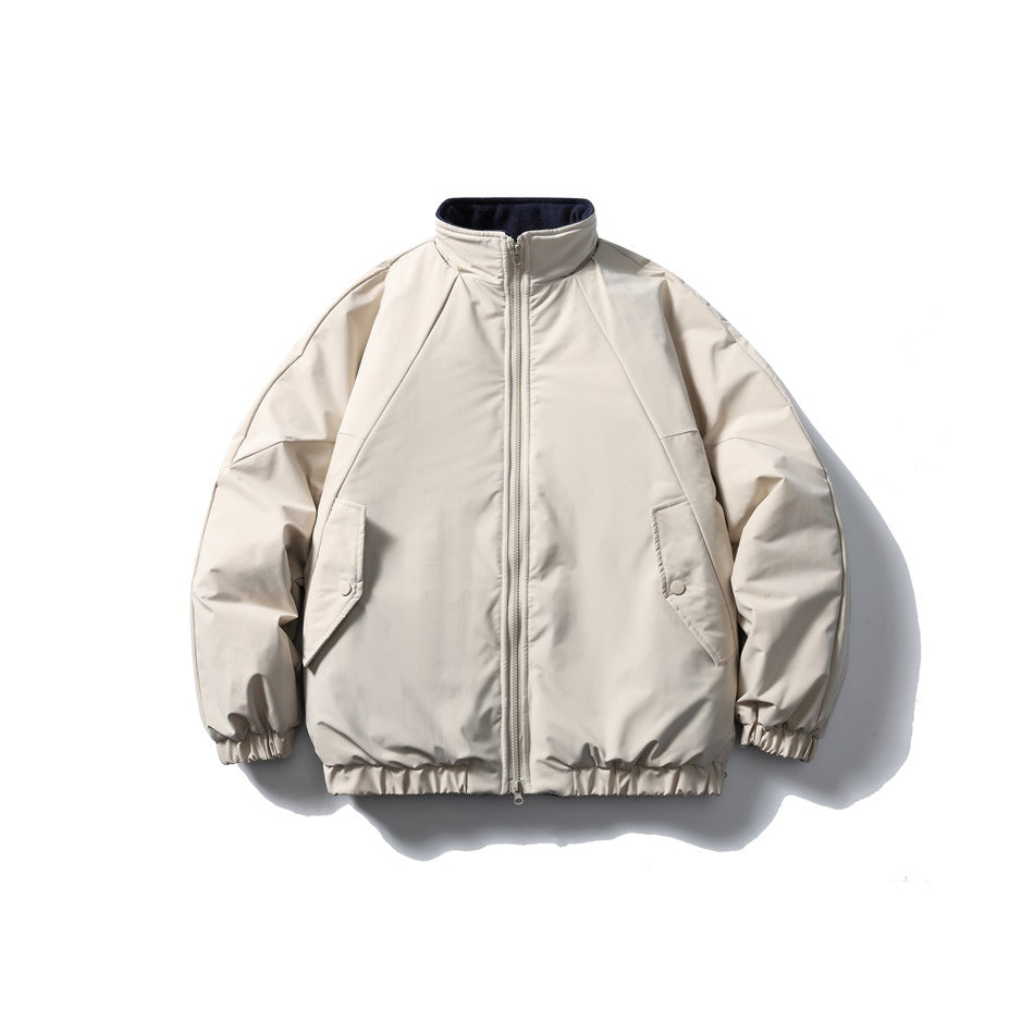 Beige stand-collar zip jacket with raglan sleeves, flap pockets and navy fleece-like collar lining, front view
