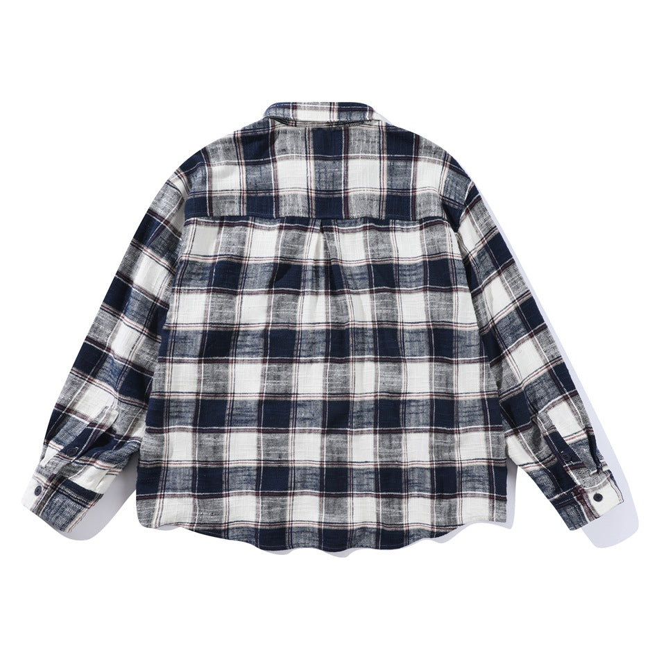 Back view of a white, gray and navy plaid button-up shirt with long sleeves.