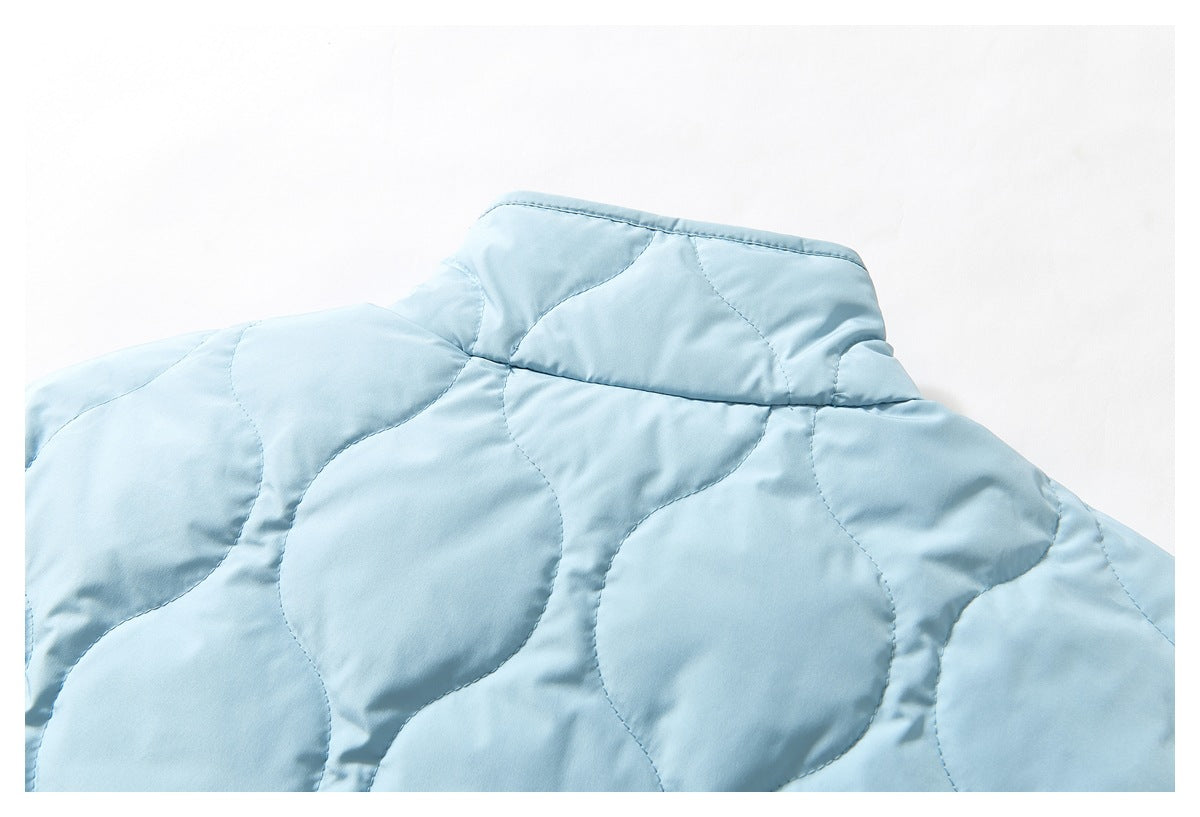 Cropped view of the light blue jacket's back, showing its stand collar and rounded quilted pattern.