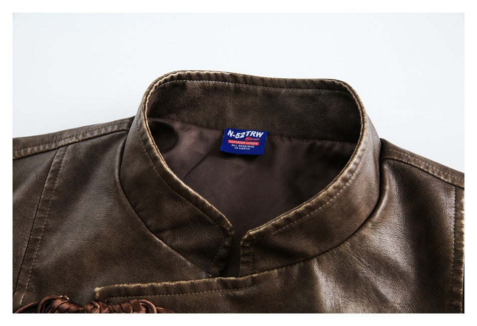 Close-up of a brown jacket's stand collar, front seam, and sewn-in neck label.