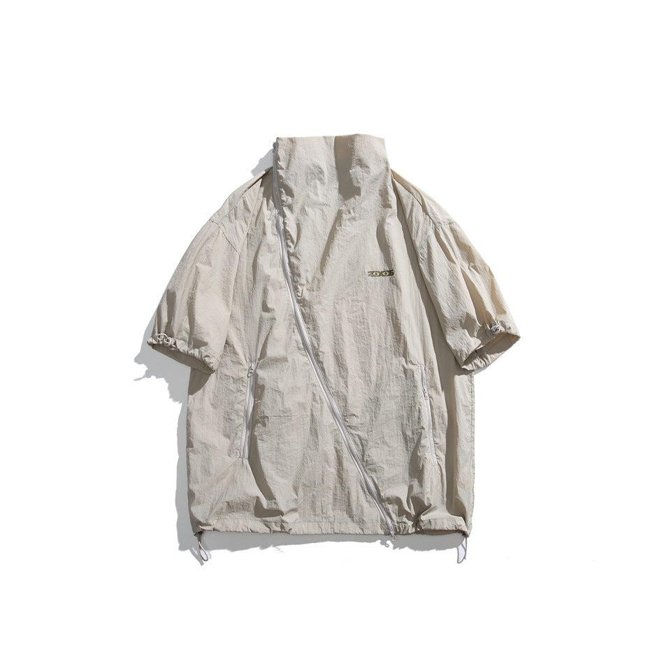 Khaki short-sleeve stand-collar jacket flat lay with diagonal front zipper, side zip pockets and drawstring hem