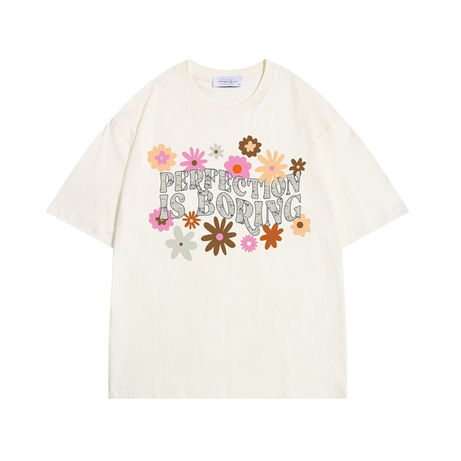 Apricot cream short-sleeve crew neck T-shirt with retro flowers and 'PERFECTION IS BORING' print