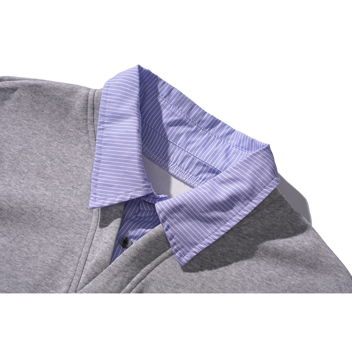 Close-up of a gray top with a lavender-and-white striped shirt collar and placket.