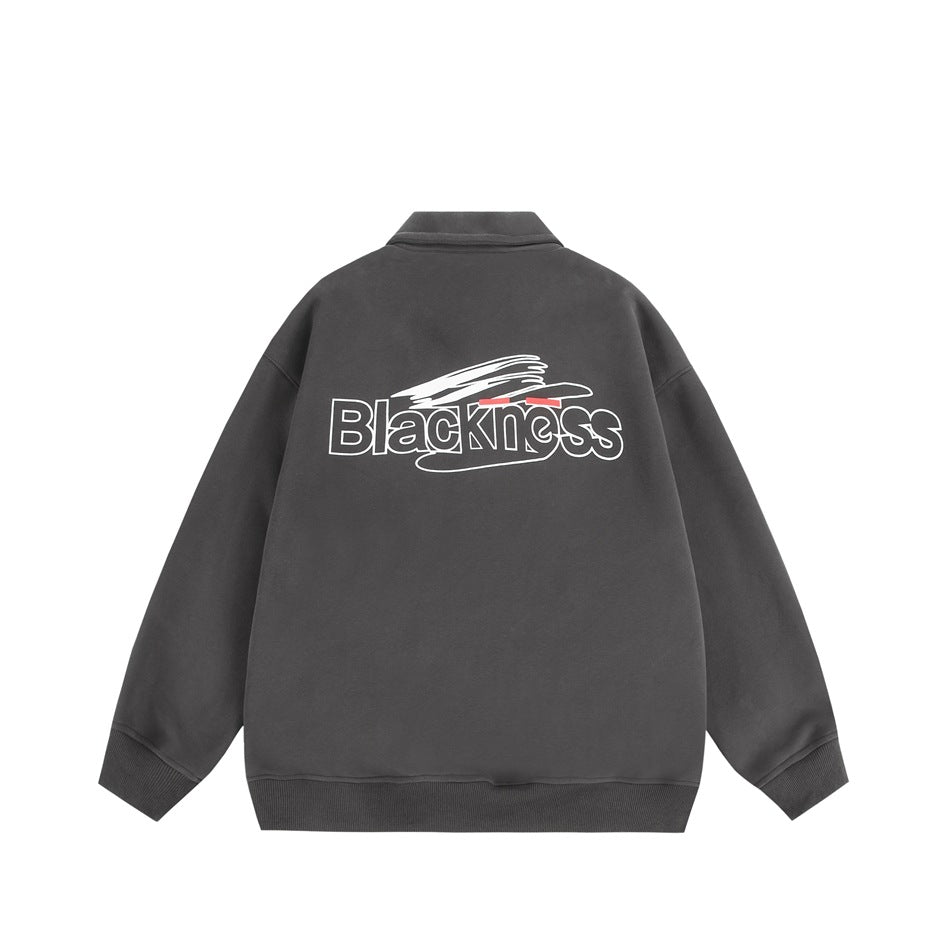 Back view of a charcoal pullover sweatshirt with ribbed cuffs and hem and a white, red, and black graphic.