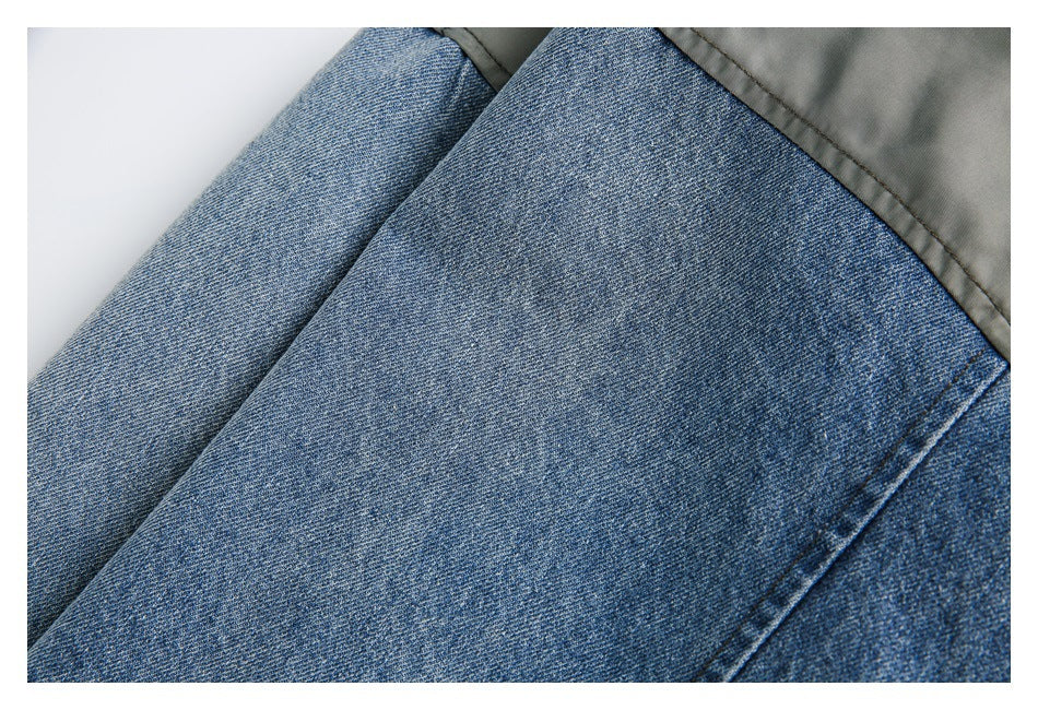 Close-up of blue denim fabric with visible diagonal weave beside a gray panel.