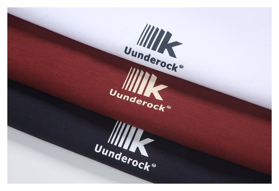 Close-up of white, burgundy, and black fabric bands, each printed with a Uunderock logo.