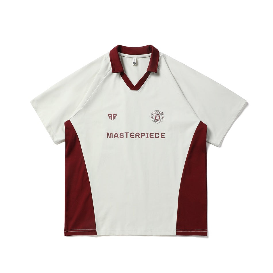 Cream short-sleeve polo-collar jersey top with burgundy collar, side panels and chest print, flat front view