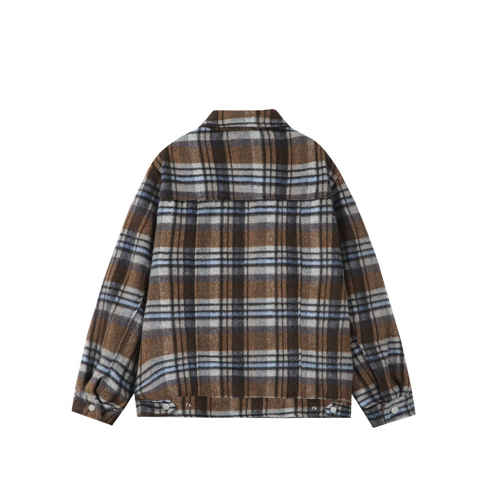 Back view of a brown, gray, and white plaid jacket with a yoke seam and adjustable buttoned cuffs and hem.