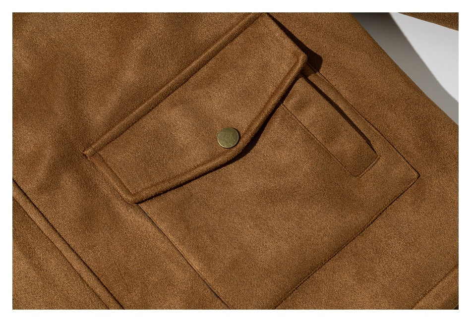 Close-up of a camel jacket's large flap pocket with a metal snap.