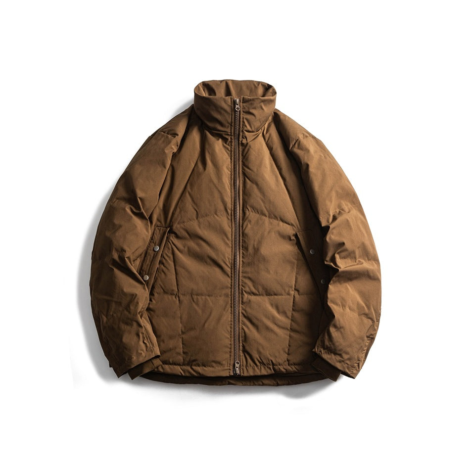 Brown quilted stand-collar puffer jacket with front zipper and snap side pockets, flat lay front view