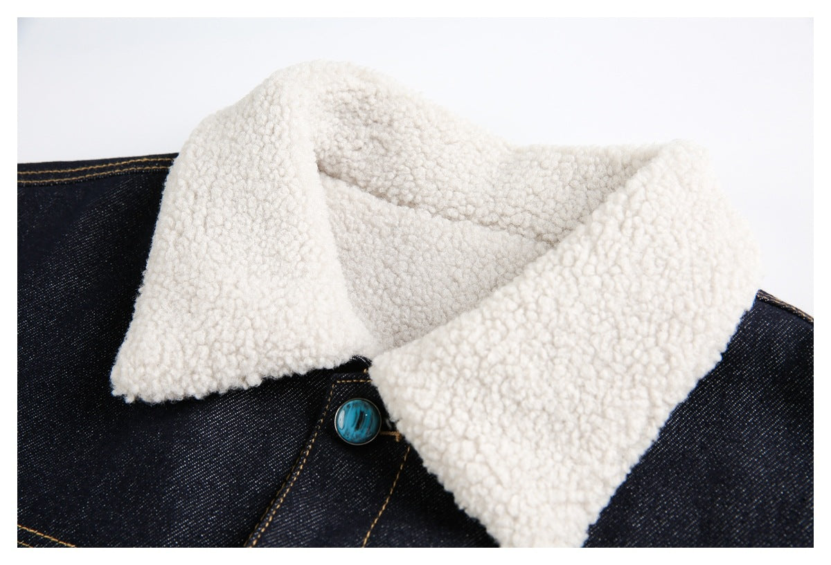Close-up of the jacket's wide cream sherpa collar and a turquoise front button.