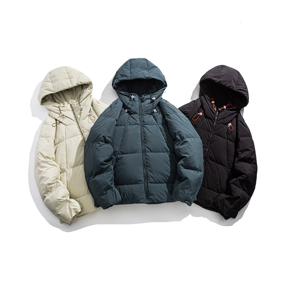 Three hooded puffer jackets arranged together in cream, slate gray, and black colorways.