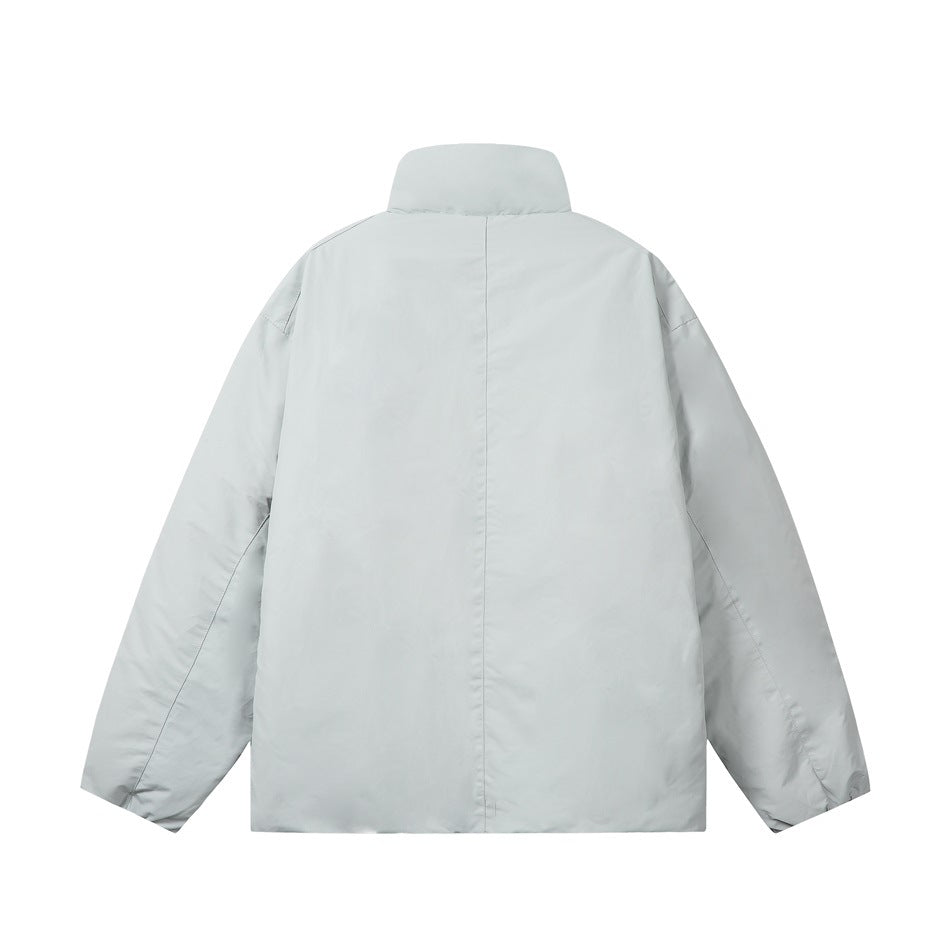 Back view of a pale gray jacket with a stand collar, long sleeves, and a center seam.